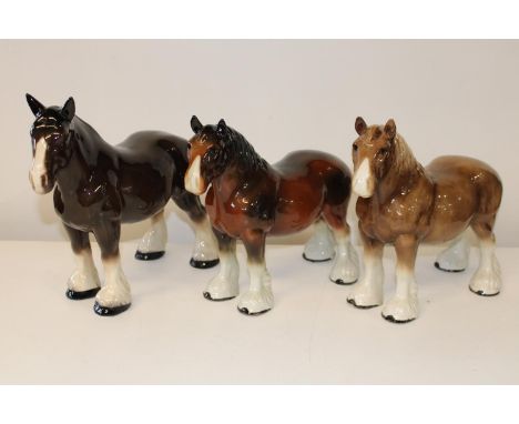 Three large ceramic shire horses 