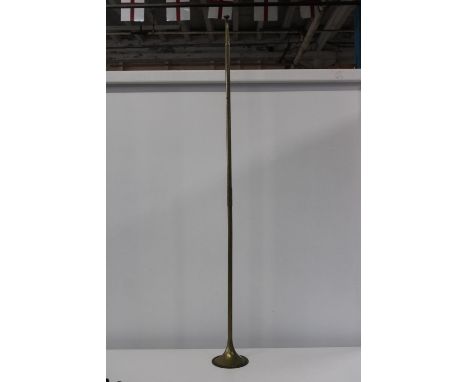 A vintage brass hunting horn 120cm in length 