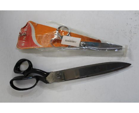 A pair of vintage Wilkinson seamstress scissors 13 inches. And a pair of Singer scissors- 