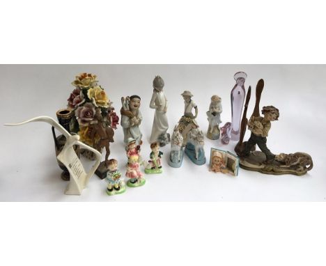 A number of ceramic and other figurines to include NAO, Valencia, Regal Bassano, etc 