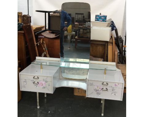 A 1970s dressing table, with tall adjustable mirror, glass shelf and four drawers, 145cmW 