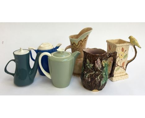 A small lot of jugs and teapots, to include Poole pottery 