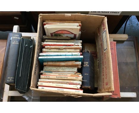 A mixed lot to include several books, a collection of Ordnance survey maps, vintage postcards, and a washboard 