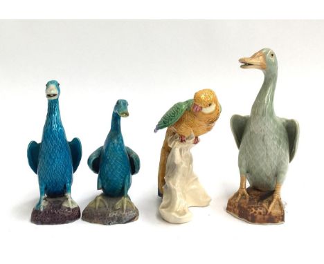 A lot of four continental ceramic bird figures, three ducks and one parrot (4) 