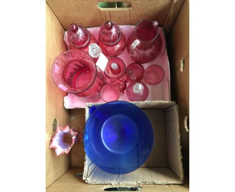 A selection of cranberry glassware, to include a Dartington Ruby glass jug, bottles, lidded jars etc; together with an art gl