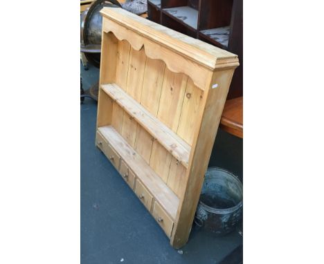 A pine hanging shelf, two shelves with five small drawers below, 94cmW 