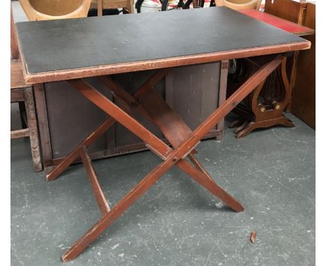 A folding campaign table with leather top 58x91cmW; together with a folding glazed embroidered fire screen 