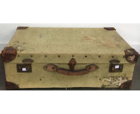 A vintage canvas covered suitcase, with leather corners, 70cmW 