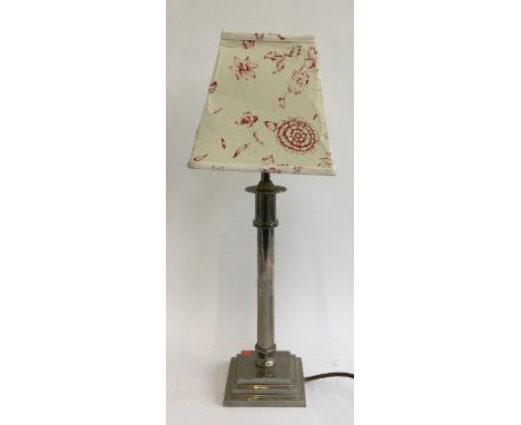 A trench art style table lamp on plinth base 