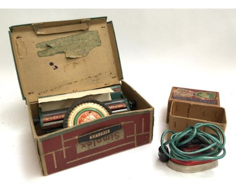 A child's tin plate Simplex typewriter in original box; together with a Clayton &amp; Lewis ltd travel iron 