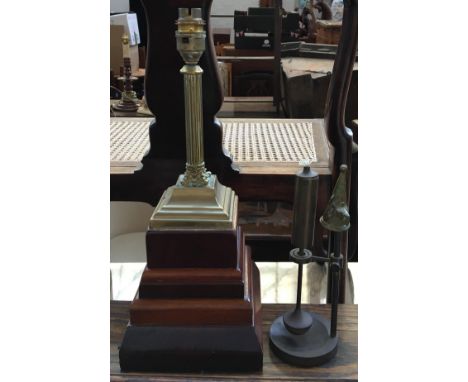 A brass table lamp in the form of a Corinthian column on large stepped plinth base, 38cmH; together with a ships oil lamp on 