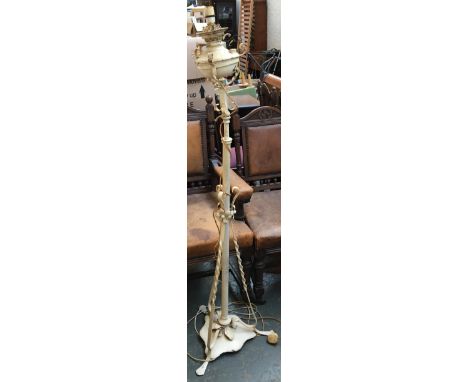 A white painted standing oil lamp, converted for electrical use 