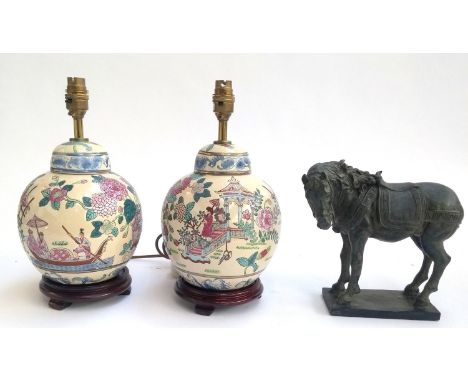 Two ceramic Oriental lamps on hardwood bases, each 33.5cmH; together with a resin figure of a horse, 22cmH 