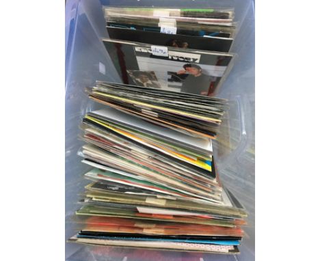 A box of vinyl singles to include Lionel Richie, Michael Jackson, Meatloaf, Modern Romance, Mike Oldfield, The Police etc 