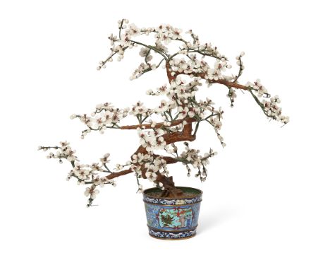 A Chinese hardstone tree in a cloisonné-enamel jardinièreEarly 20th centuryFormed as a gnarled flowering prunus issuing from 