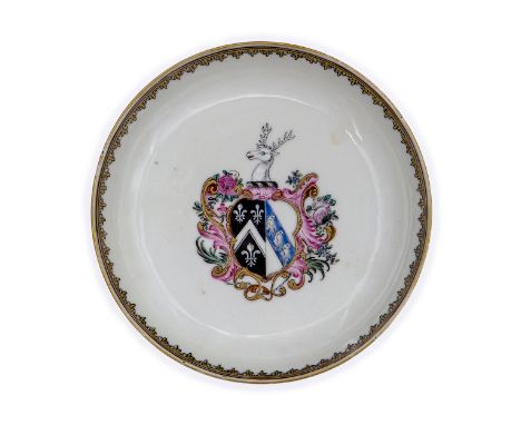 A Chinese famille rose armorial saucerQing dynasty, Qianlong periodBrightly enamelled to the centre with a coat of arms surmo