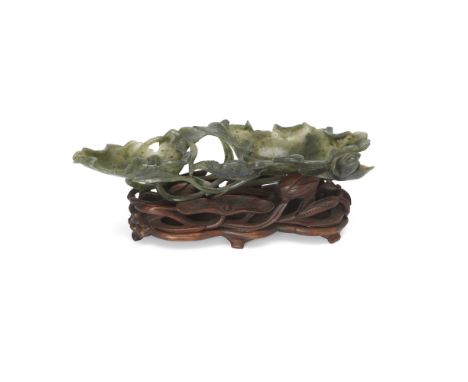 A Chinese spinach jade 'lotus leaf' washer, bixiLate Qing dynastyCarved from a single piece of jade in open work of two lotus