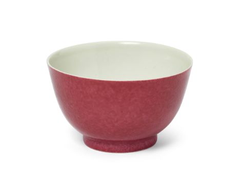 A Chinese famille rose ruby-back cupQing dynasty, Yongzheng periodWith a leafy peony flowerhead to the centre, 8cm diameter.清
