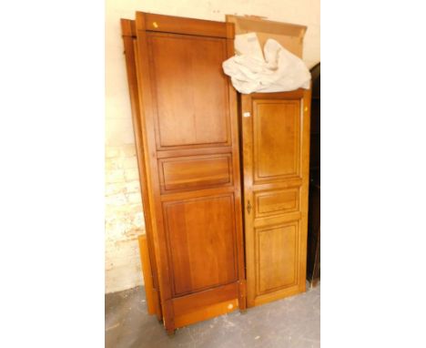 A 20thC armoire, with three panelled doors to front, unassembled, with instruction manual. 