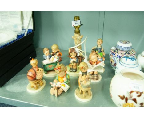 NINE W. GOEBEL (HUMMEL) FIGURINES INCLUDING AN ELECTRIC TABLE LAMP (9) 