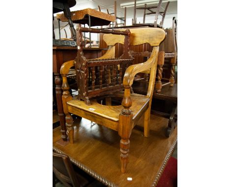 A VICTORIAN HARDWOOD COMMODE ARMCHAIR AND A STAINED WOOD PERIODICAL RACK 