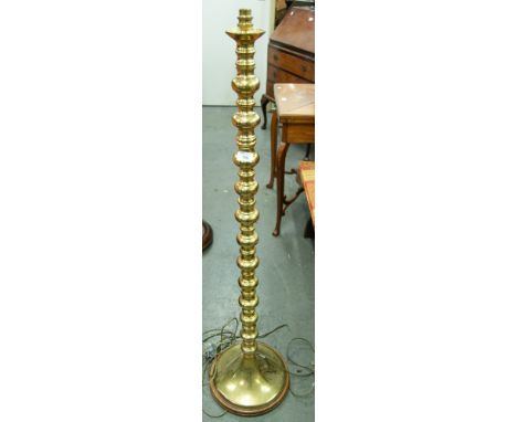 A BRASS STANDARD LAMP, SILK SHADE OVER SQUAT BRASS BALL SPACER COLUMN, ON SPREAD BASE 