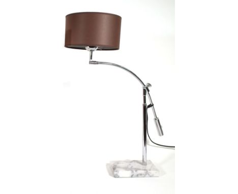 An adjustable chrome table lamp on a rectangular white marble base, approx, 70cm high. 