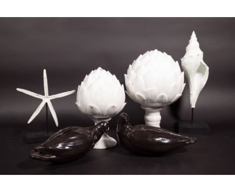 A pair of brown glazed pottery doves, a graduated pair of white ceramic artichokes, a stained carved acorn finial and a woode