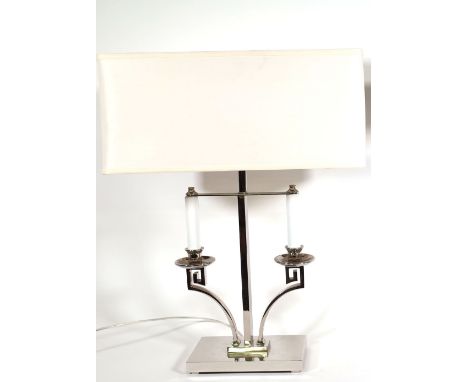 A stainless steel table lamp formed as a stylised candelabra, 50cm high including fitment. 