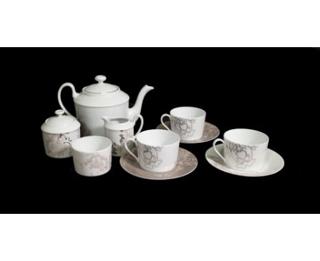 A Limoges Boudoir three person tea set, comprising; a teapot, three cups and saucers, a milk jug and two sugar pots, (10). 