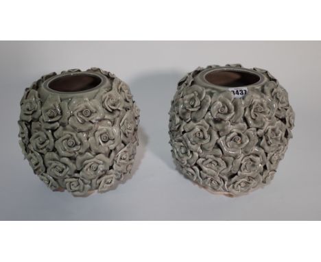 A pair of grey ceramic vases with applied rose decoration, 23cm high. 