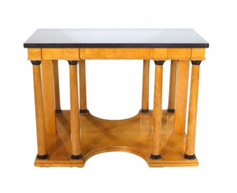 A pair of Biedermeier style black marble topped console tables with mirrored backs, 112cm wide x 90cm high x 51cm deep.