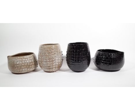 A group of six ceramic jardinieres with faux crocodile skin moulded decoration, the largest 25cm high. 
