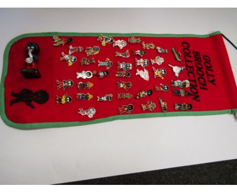 A selection of golly enamel badges