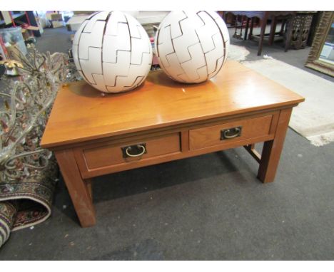 A light oak two drawer coffee table, 100cm x 60cm x 48cm