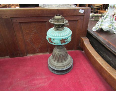 A Victorian oil lamp with turquoise coloured reservoir, floral design