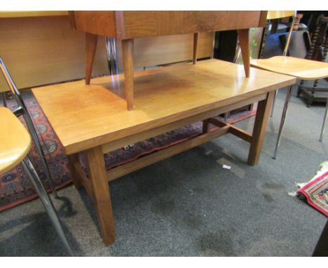 A light oak rectangular occasional table on chamferred square legs joined by an 'H' stretcher, 96cm wide x 46cm high x 49cm d