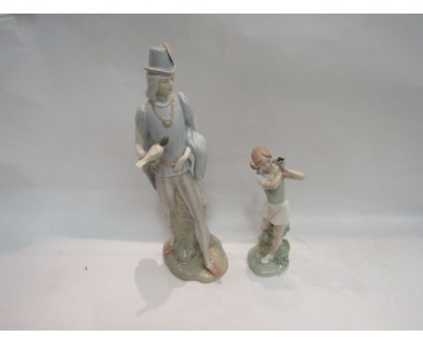 A Nao figure and a Porcival figure, girl with golf club and a man with turtle dove 