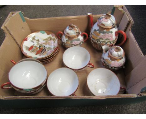 A Japanese ceramic teaset with rural scene design, some a/f