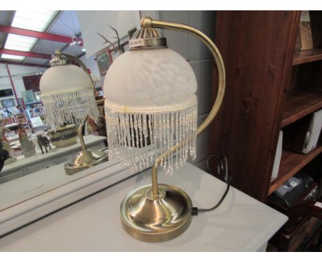 A brushed metal touch lamp with mottled glass tasselled shade, 37cm tall