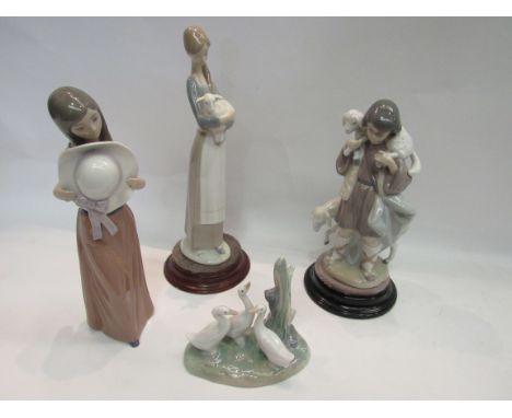 Three Lladro figures, shepherd and sheep, girl with wide brim hat, girl with lamb and Nao geese (4)