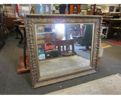 A gilt rectangular over mantel mirror, 84cm x 96cm with frame