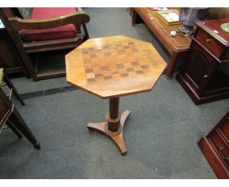 A Victorian satin walnut chess table on facet stem to trefoil base with chess pieces, 73cm high