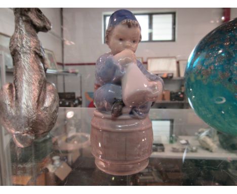 A Copenhagen figure sitting on a barrel playing a horn 3689, 11cm tall