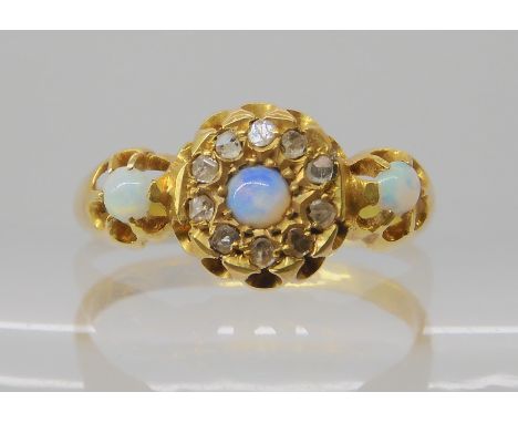 An 18ct gold opal and diamond chip ring, hallmarked Chester 1918, finger size Q, weight 3gms Condition Report: Available upon