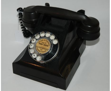 A black vintage telephone Condition Report: Available upon request