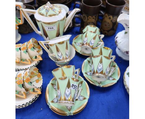 A Royal Albert Art Deco Coffee set comprising coffee pot, milk jug, sugar bowl, six cups and five saucers Condition Report: A