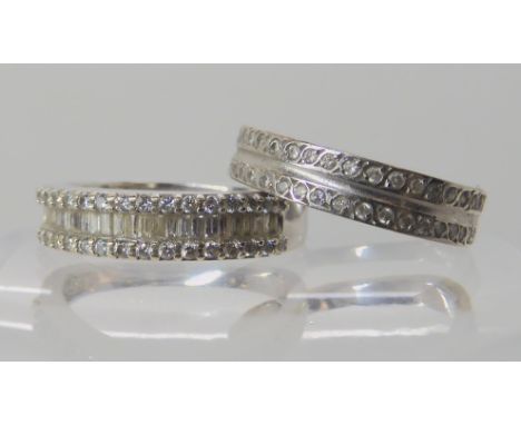 An 18ct white gold diamond eternity ring set with estimated approx 0.40cts of brilliant and baguette cut diamonds, size N1/2 