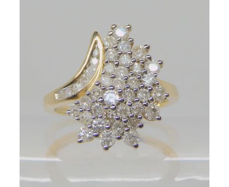 A 9ct gold diamond cluster ring set with estimated approx 0.70cts of brilliant cut diamonds, size O, weight 3.7gms Condition 