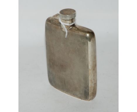 A silver spirit flask, Birmingham 1937, rectangular with engine turned decoration, 12cm x 8cm, 149gms Condition Report: Avail